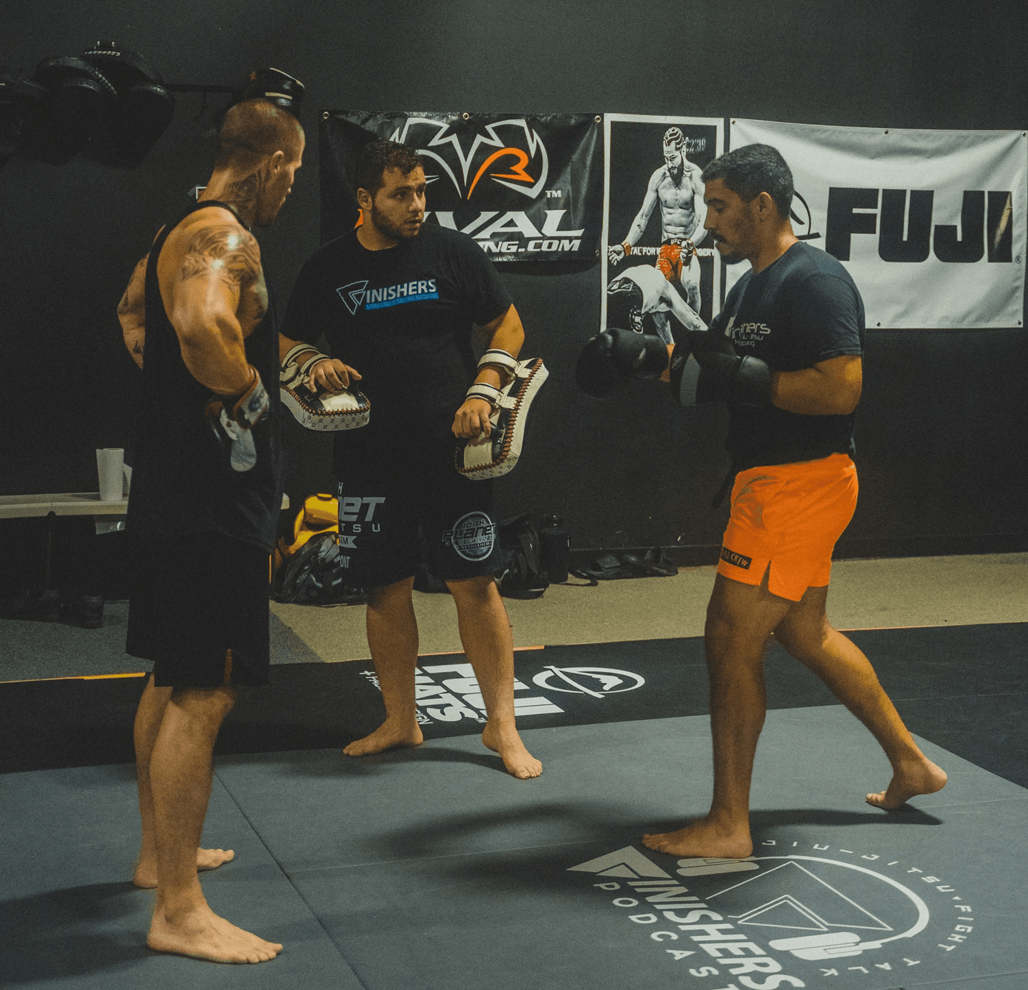 a cellphone leaning against a wall