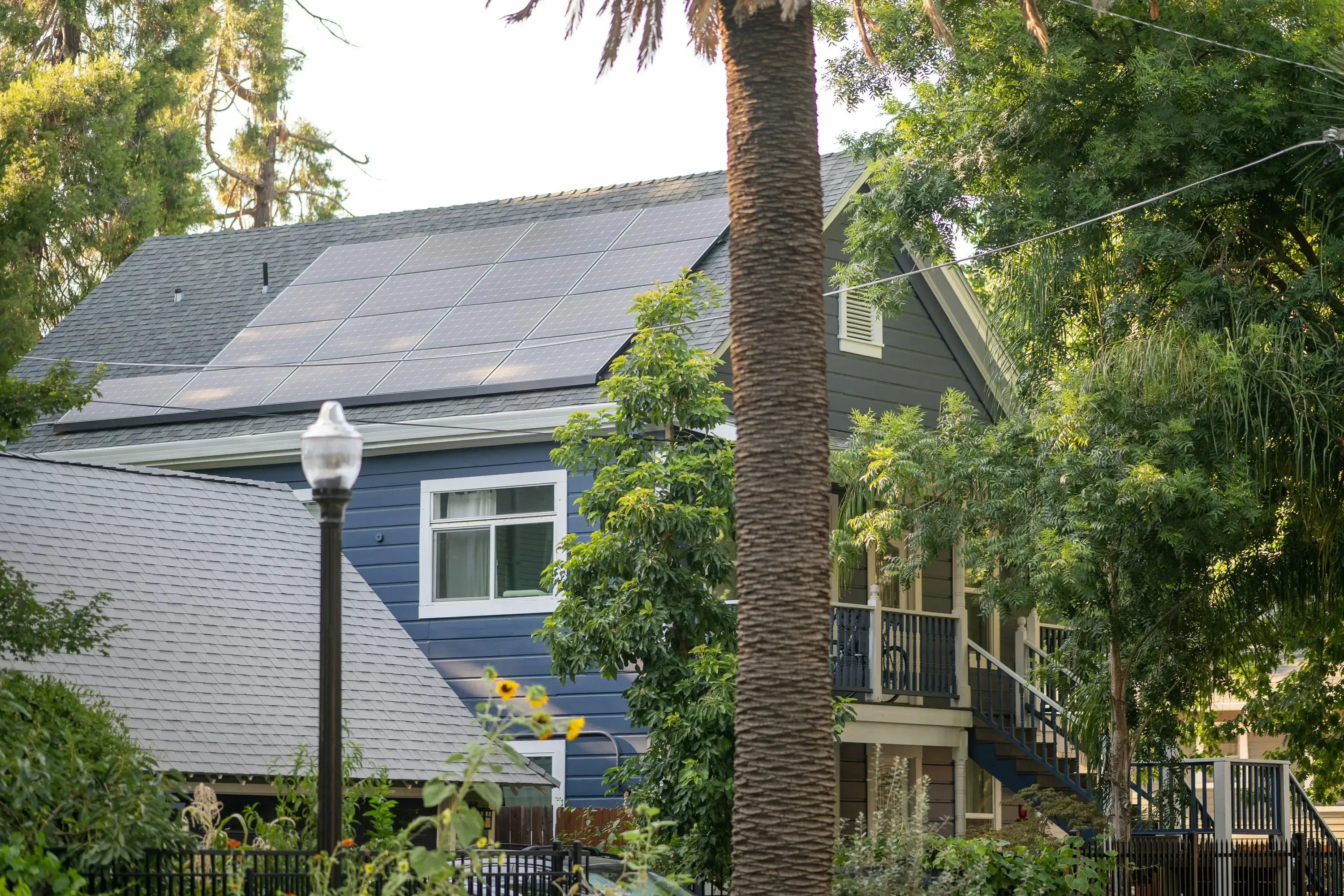 Residential property featuring a rooftop solar energy installation