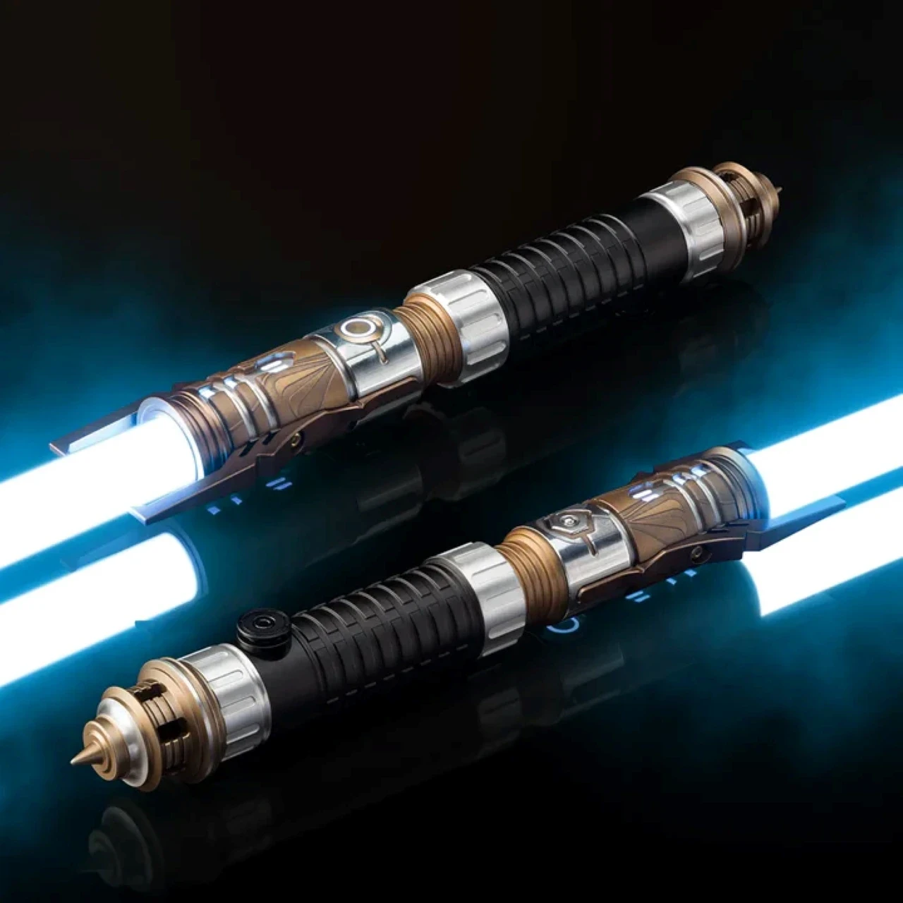 Two intricately designed blue lightsabers with metallic and black hilts lay side by side on a reflective black surface.