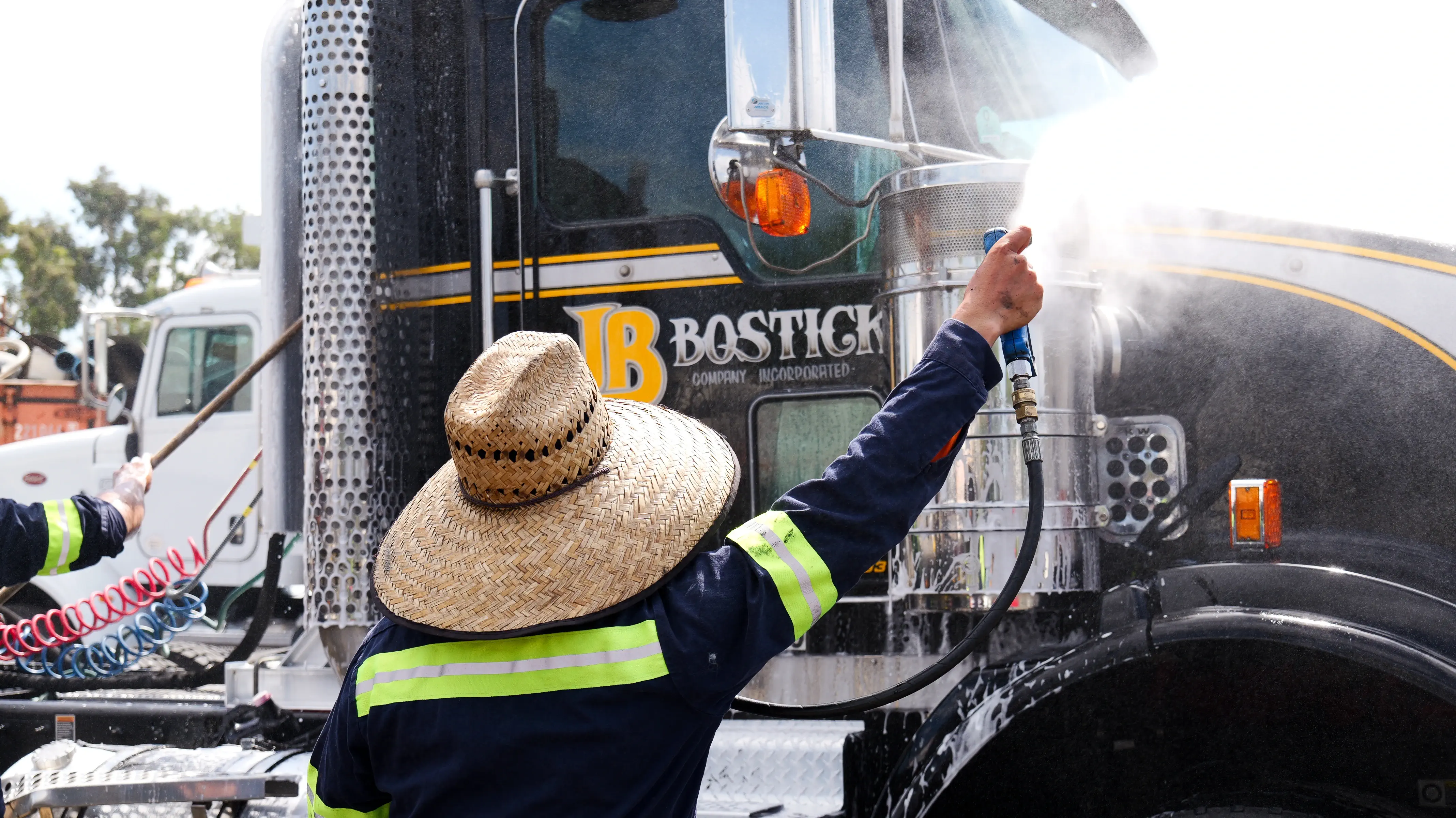 Construction worker signaling truck driver