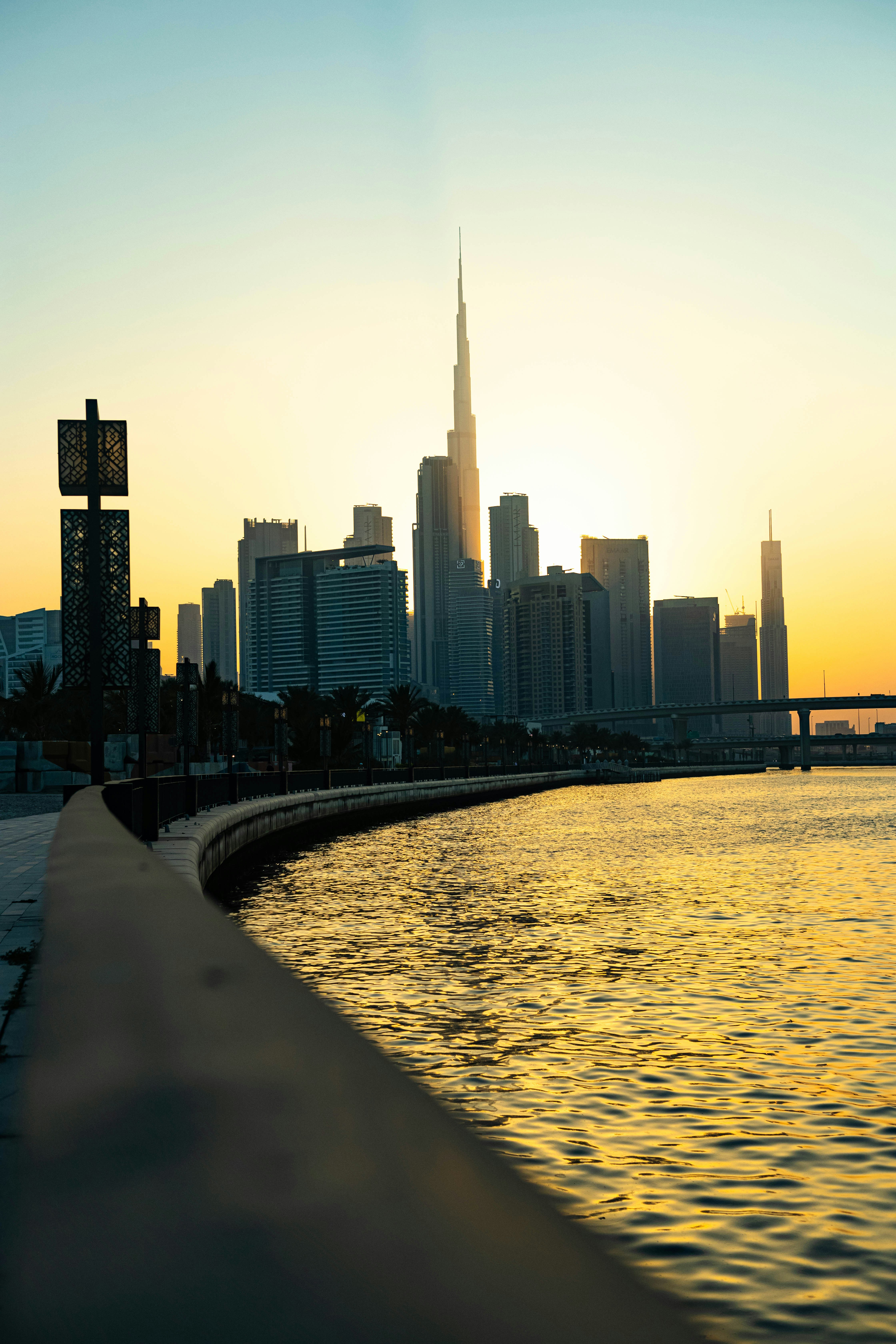 the sun is setting over the city skyline