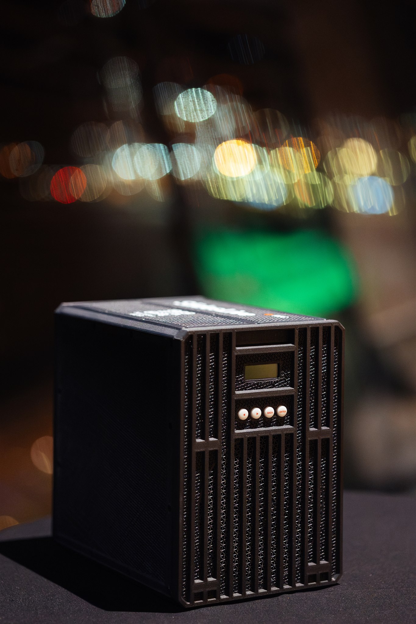 NATEBox, a custom-designed hardware unit, photographed from the front on a table.