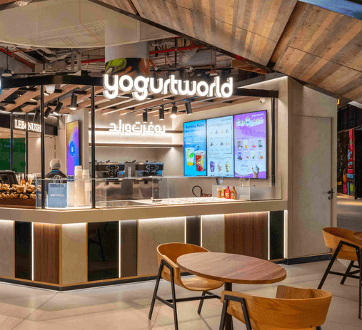 YogurtWorld store located in the Social Distrikt, offering a selection of delicious yogurt options.