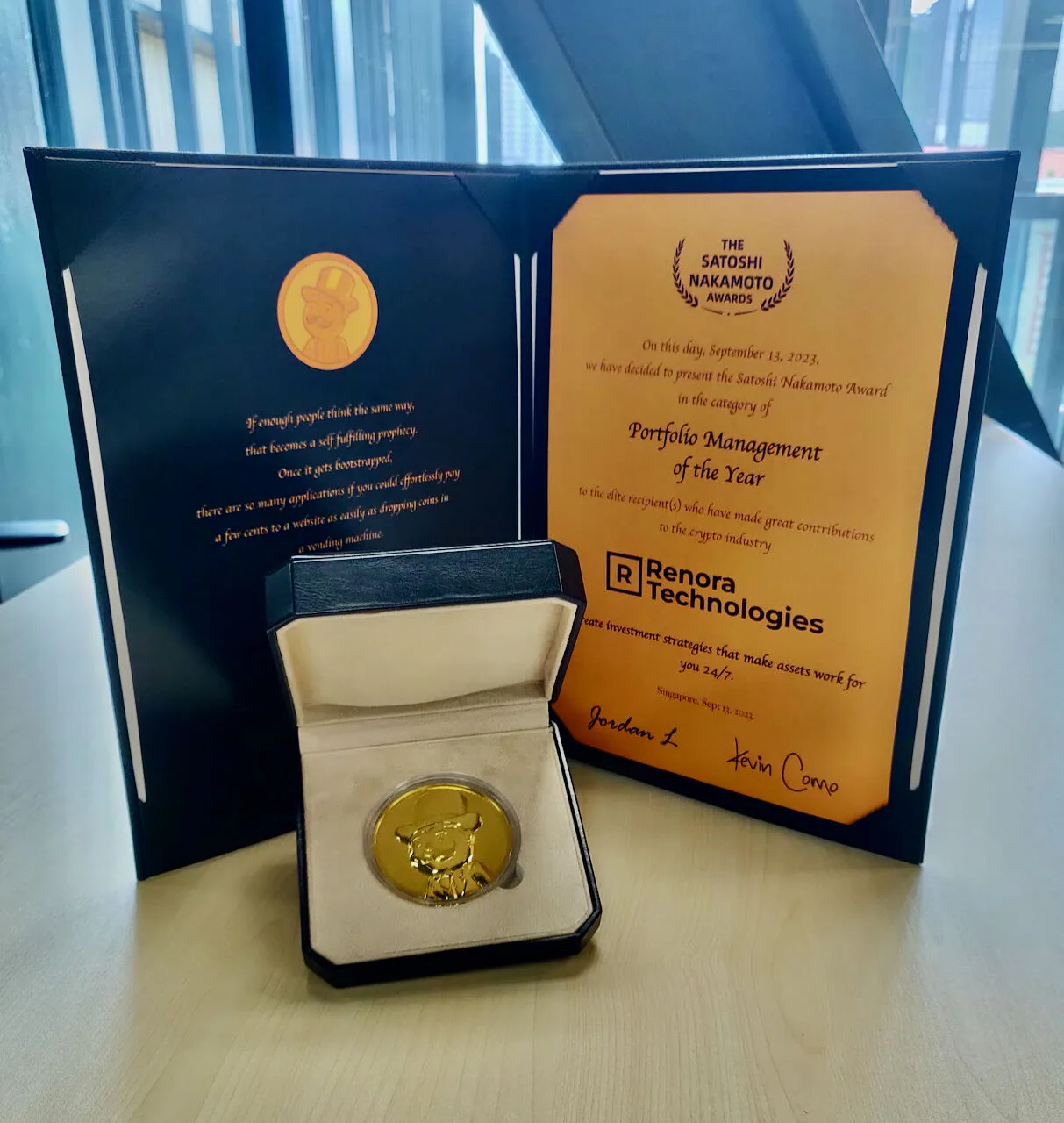 Renora Technologies receiving the Satoshi Nakamoto Award for Portfolio Management of the Year from the UXUY team in Singapore