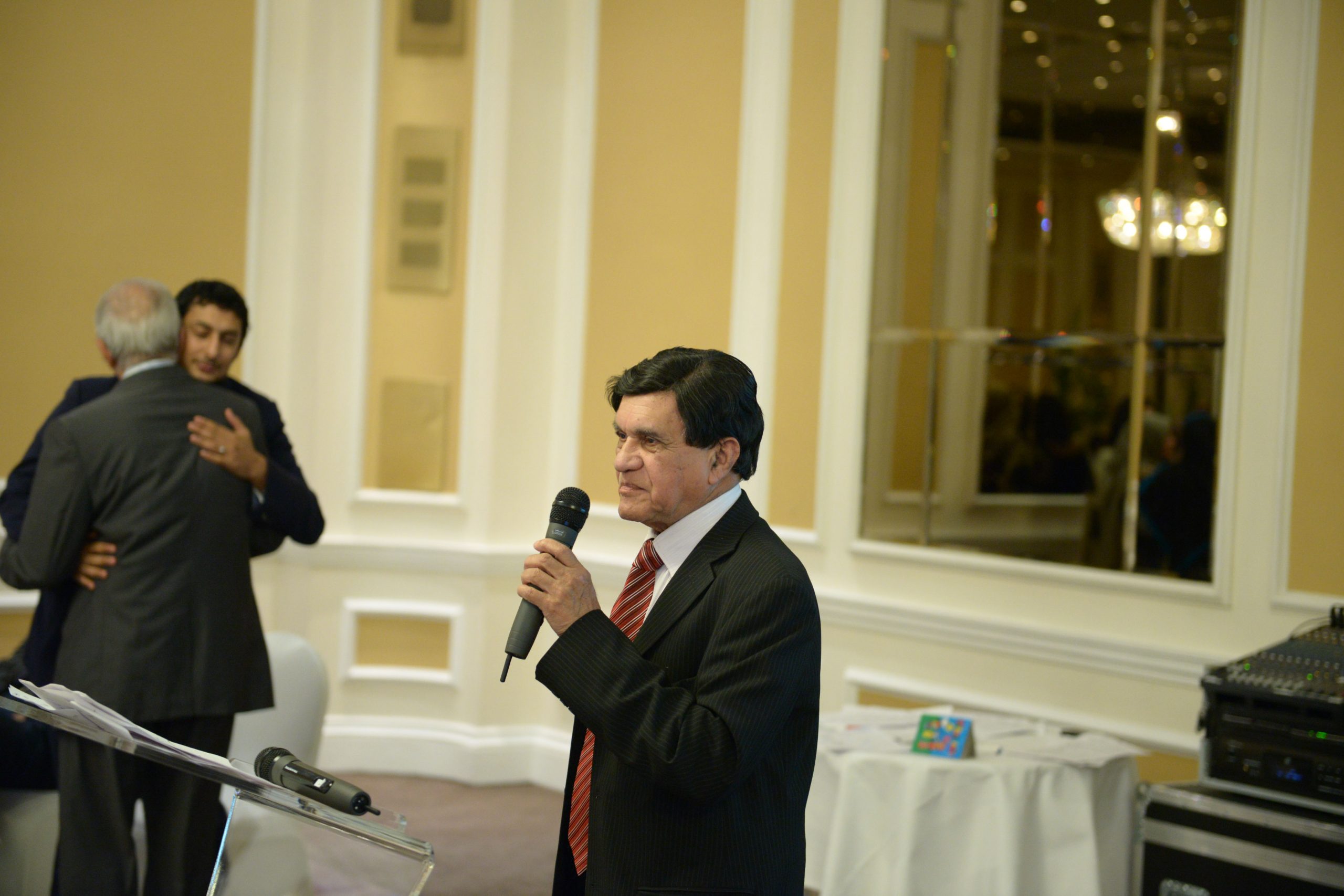 a black and white living room with a large tv