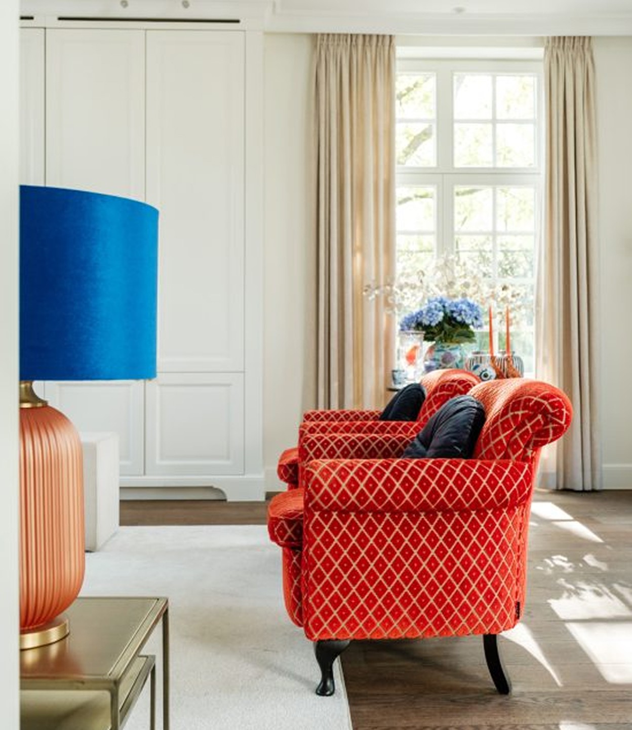 living room with red sofa's