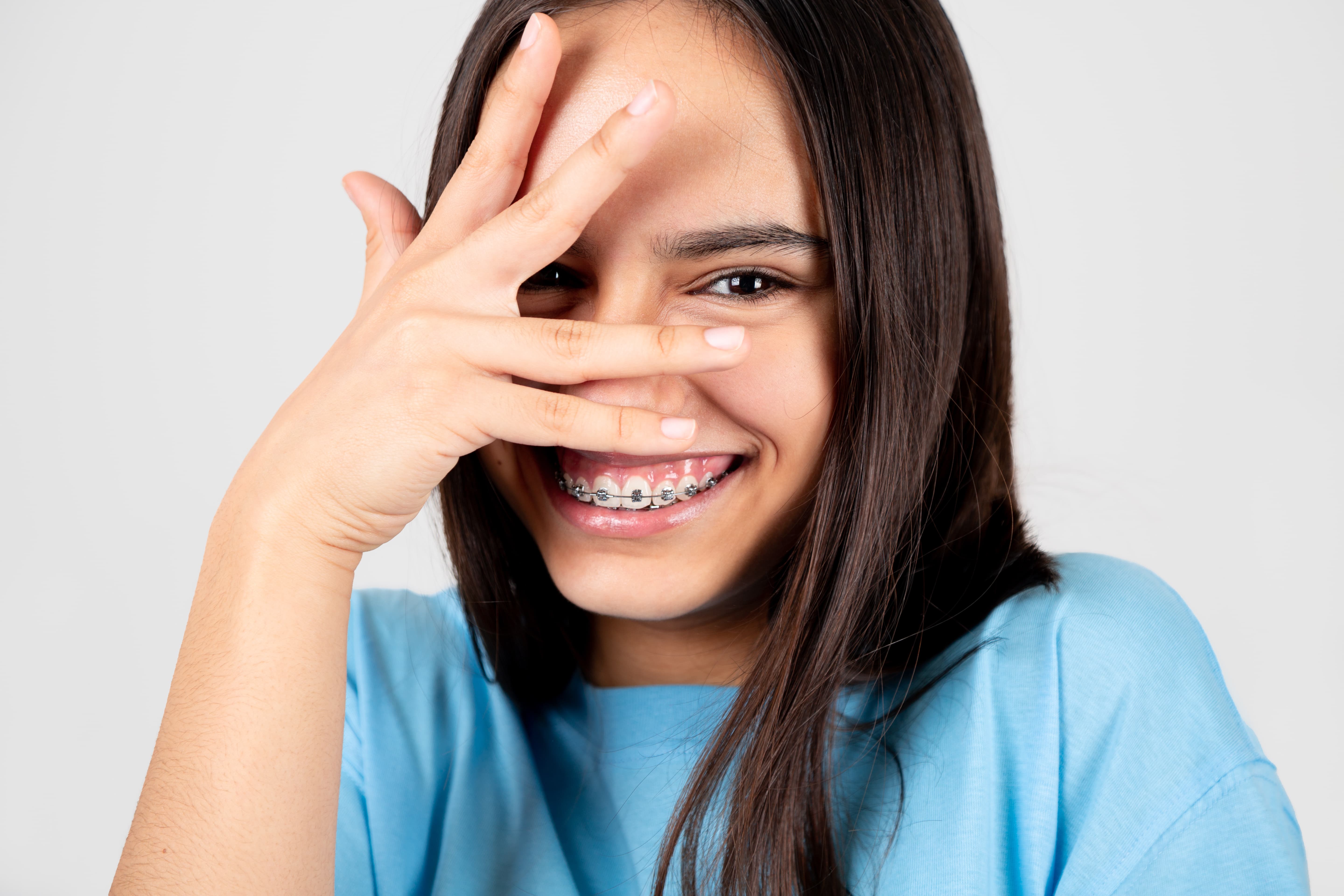 A young boy smiling with his braces