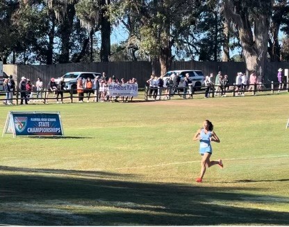 Sirja running in a cross country contest