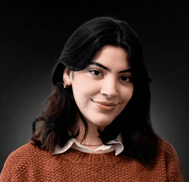 man in gray polo shirt smiling