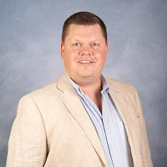 woman in black long sleeve shirt sitting on white couch
