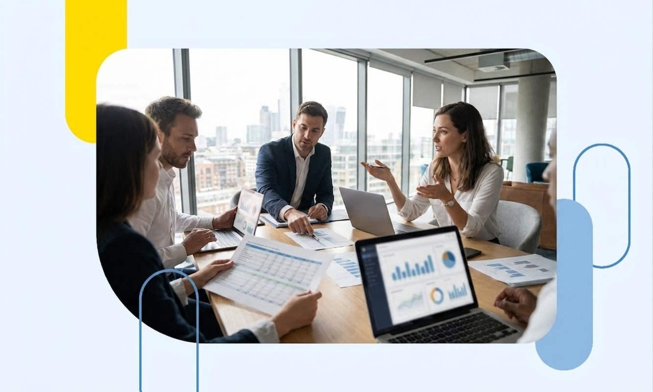 A team of business professionals reviewing financial charts in a boardroom, representing expert Amazon 1P vendor cost optimisation and profit recovery.