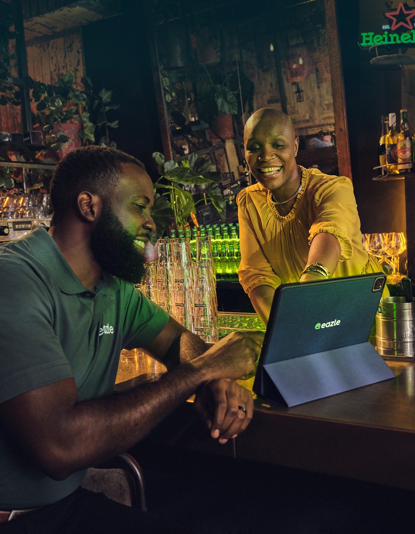 Bar owners looking at a tablet