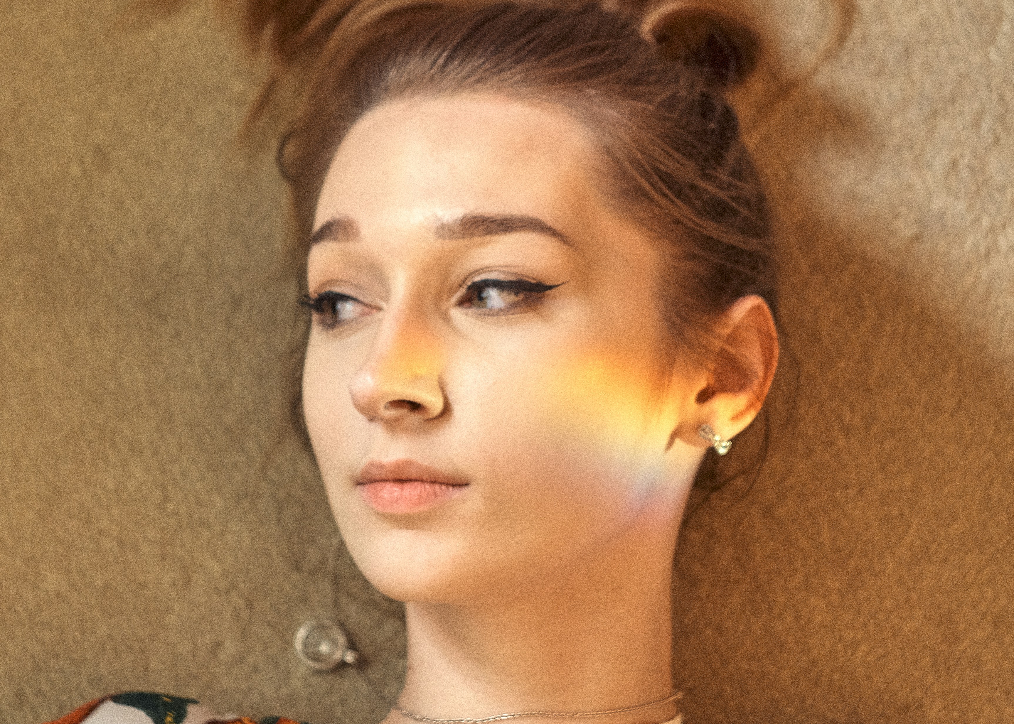 woman in silver stud earrings