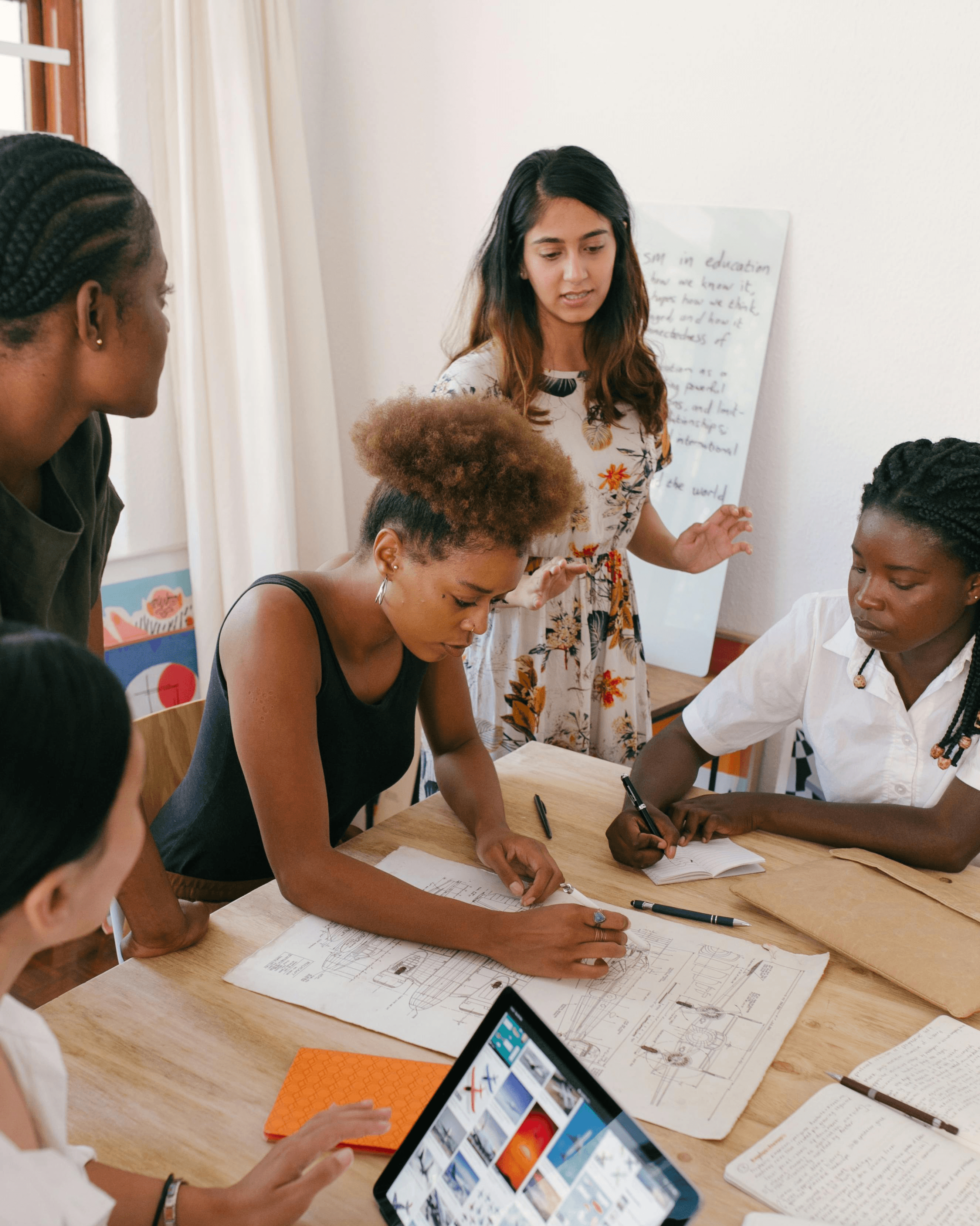 People discussing and brainstorming at a desk