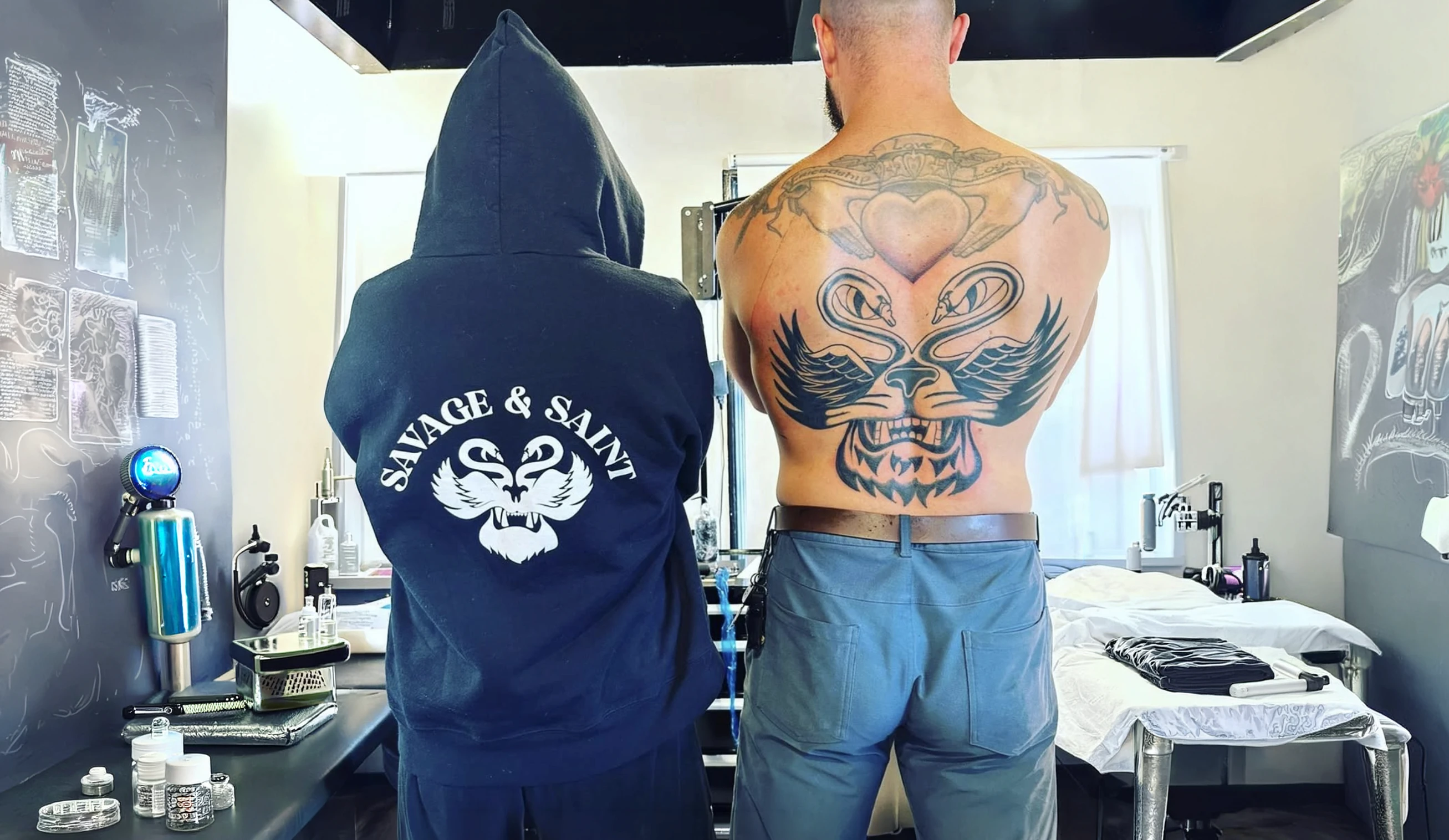 savage and saint founder Michael Holt getting his Clarity Decoded logo tattoo