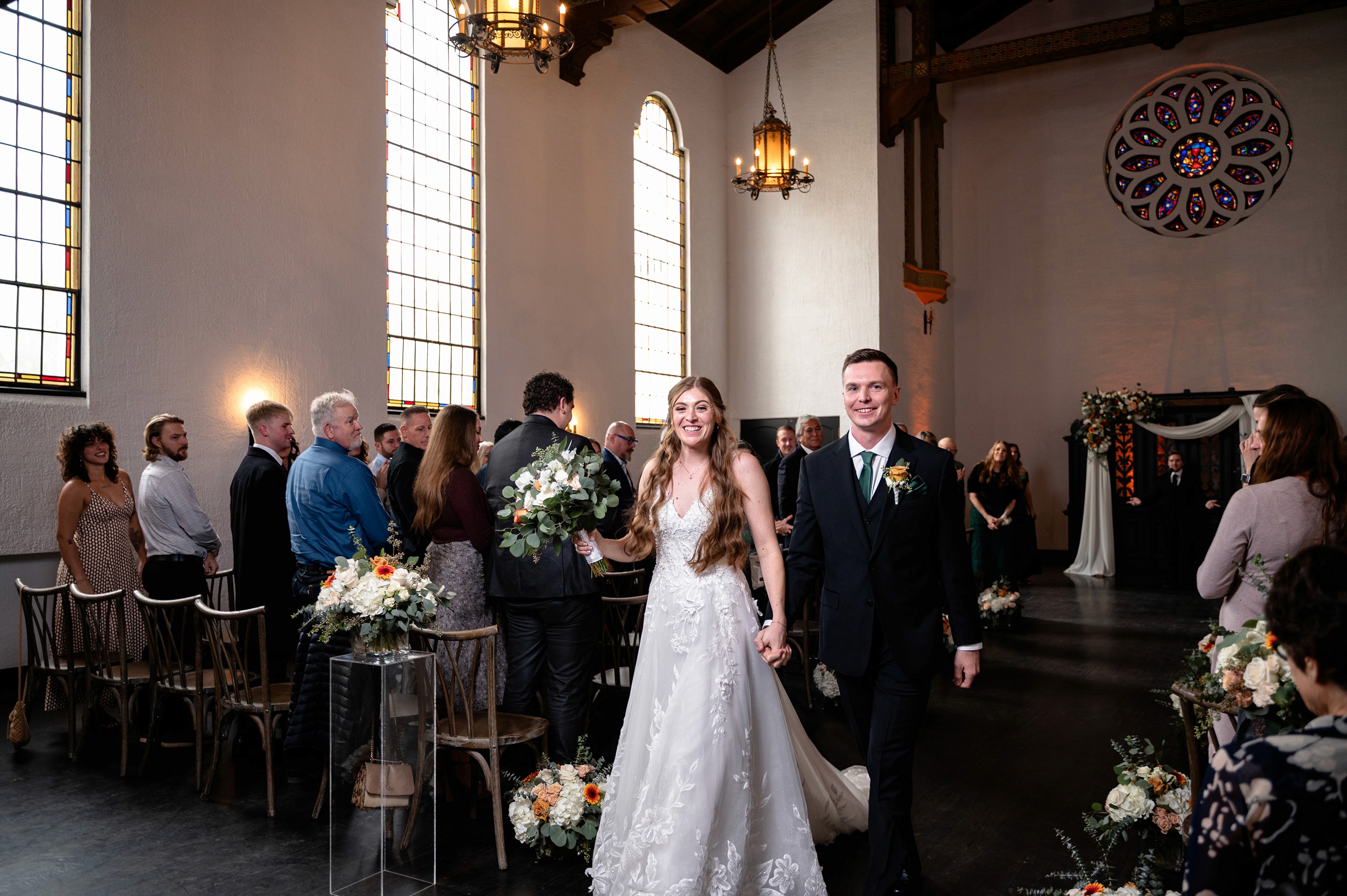 Flat lay wedding details with bouquet, rings, and sparkling bridal heels
