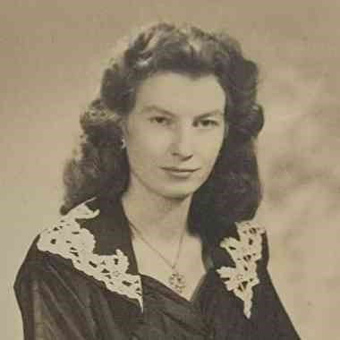 Vintage formal black-and-white portrait of a young woman