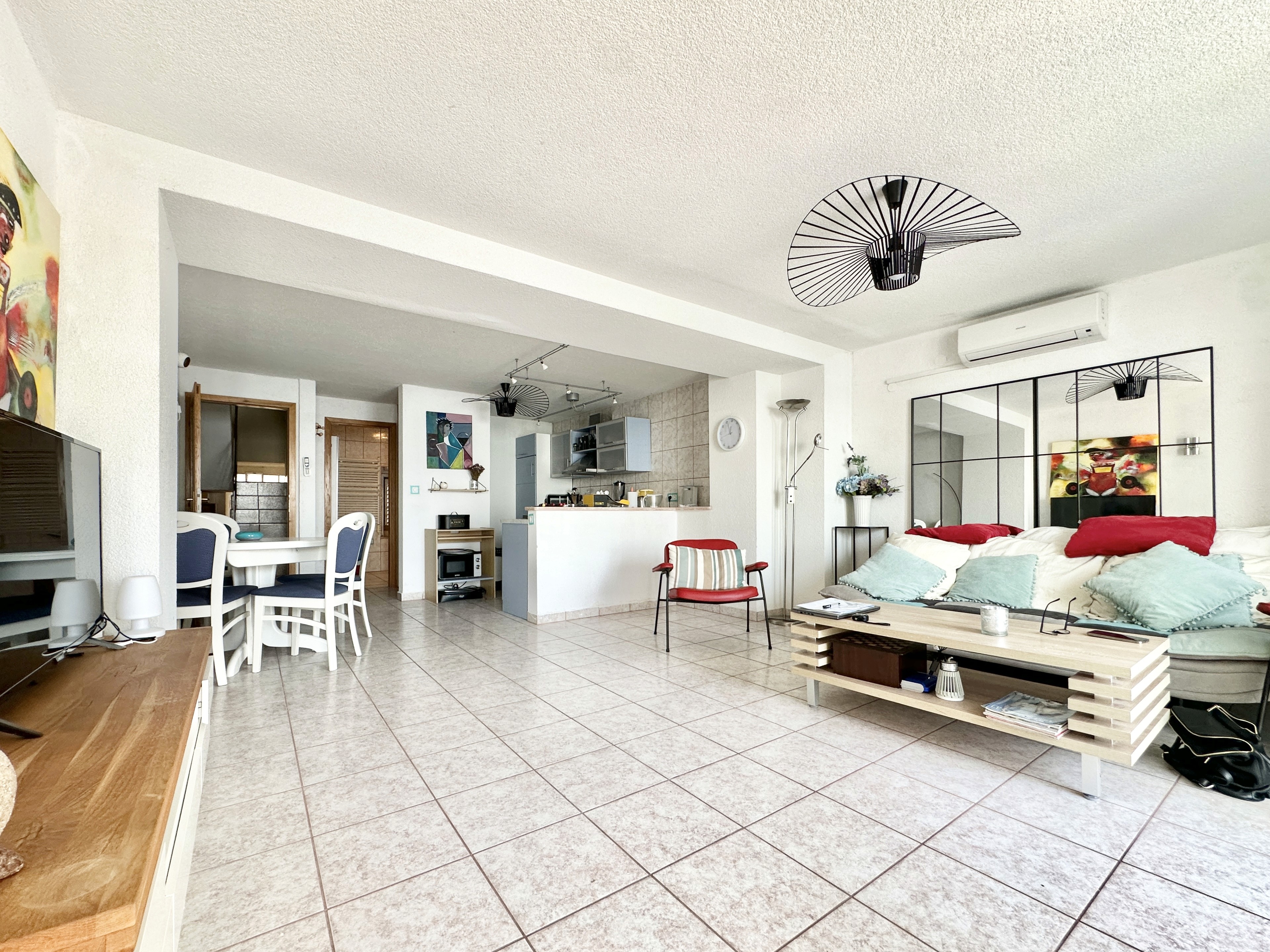 Ornate classic bathroom with claw-foot tub and wood paneling.