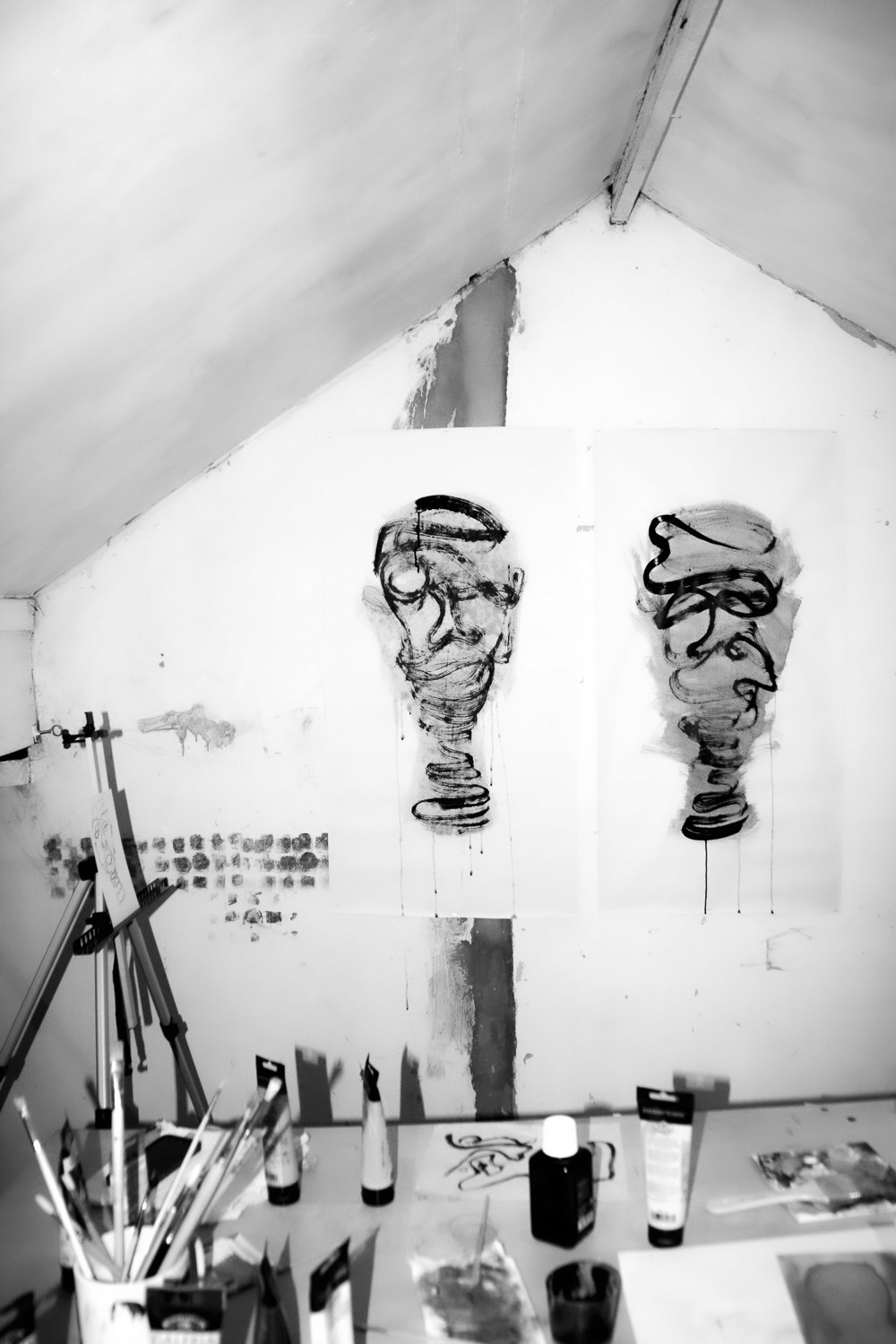 Banner image of ink portrait work in george's studio