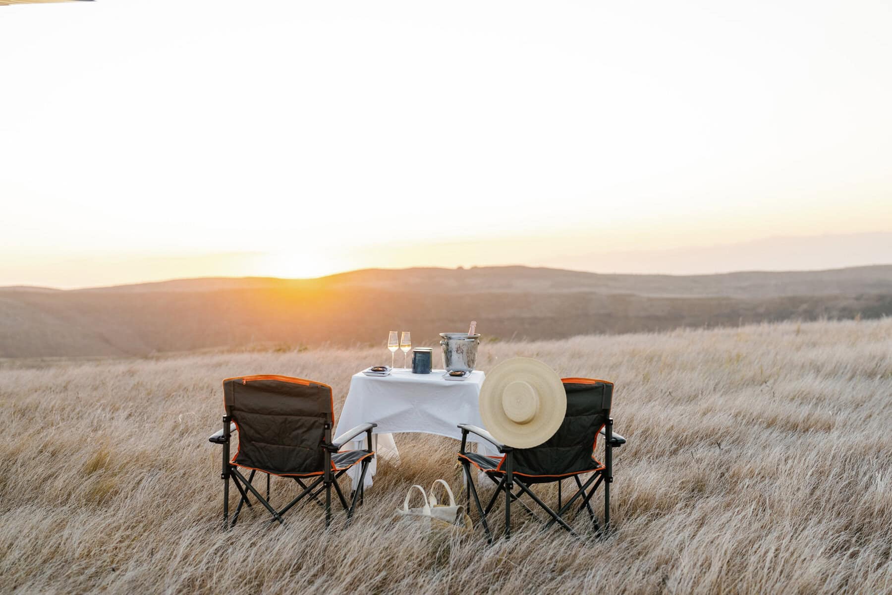 A private sundowner setting on Miavana island at sunset.