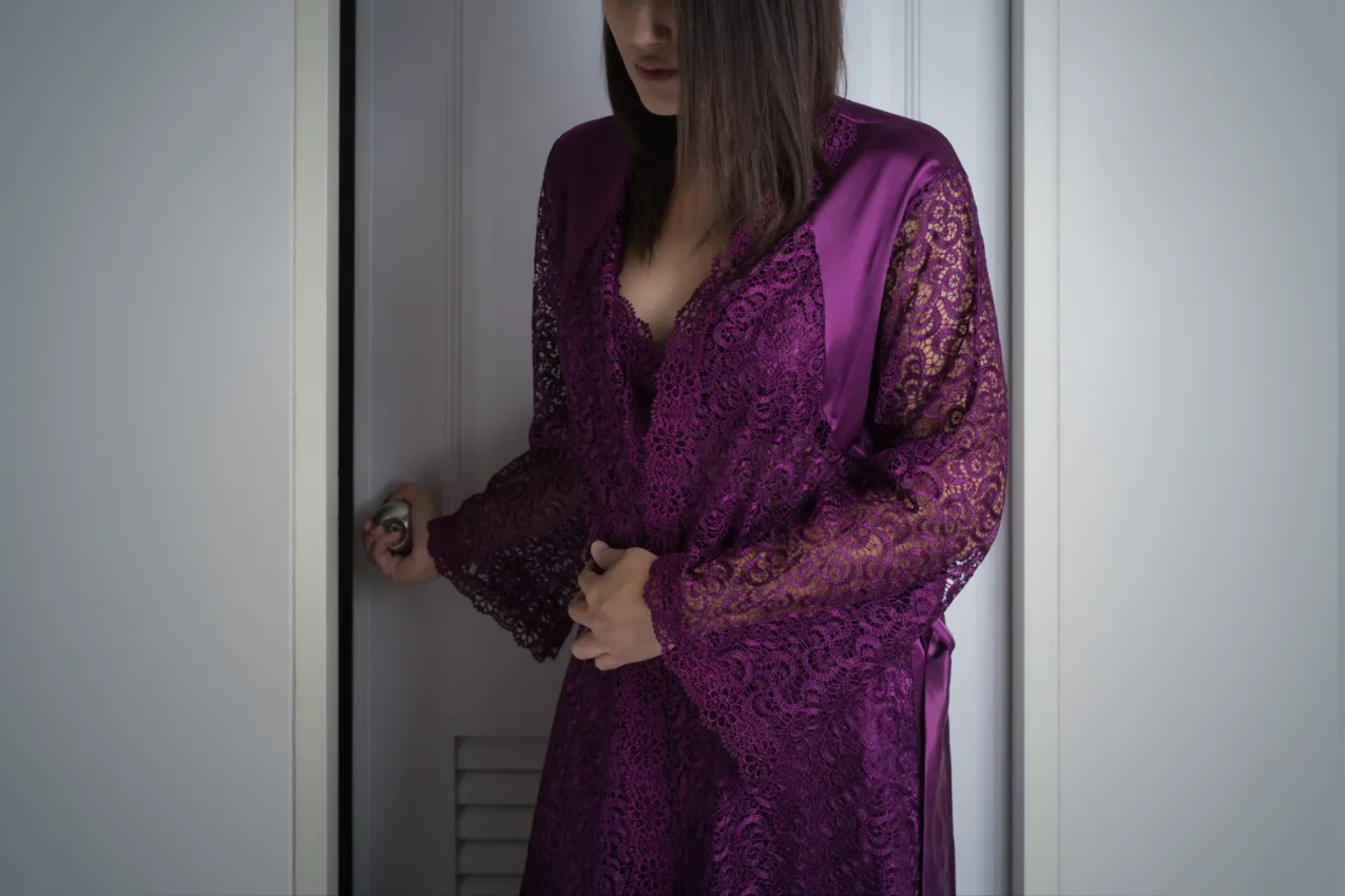 purple robe hand on door knob