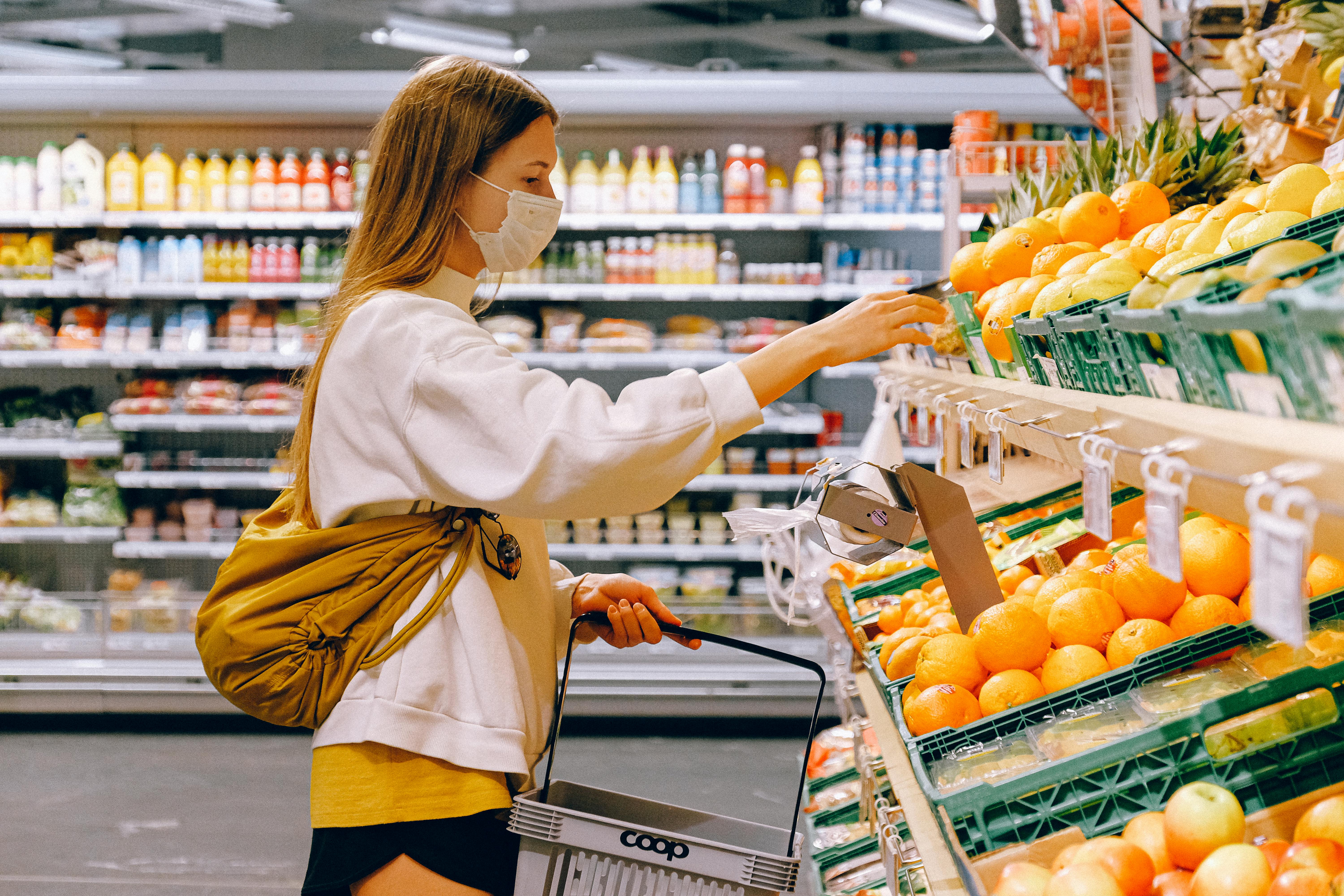 Image of a girl shopping in at a food retailer