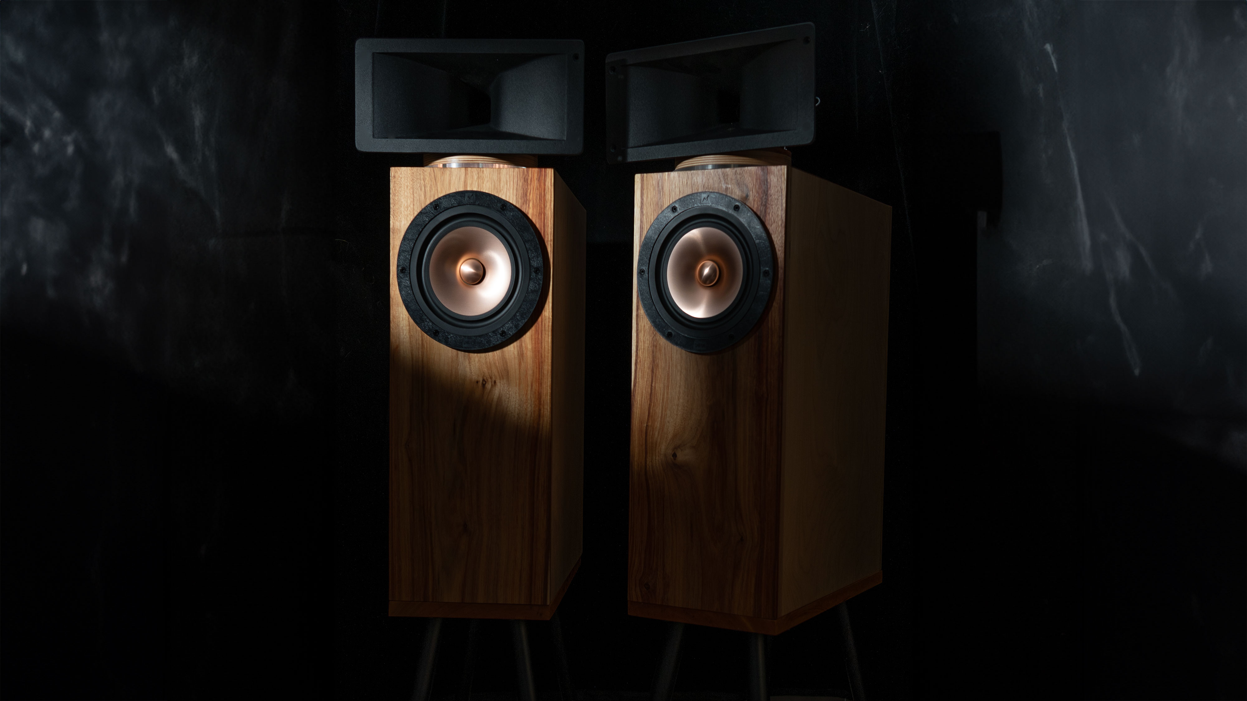 Hiro speakers in dim room, front view