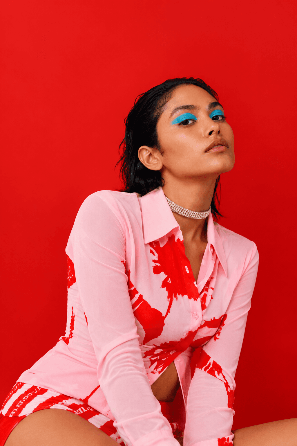 Red Editorial Portrait with Blue Eyeshadow