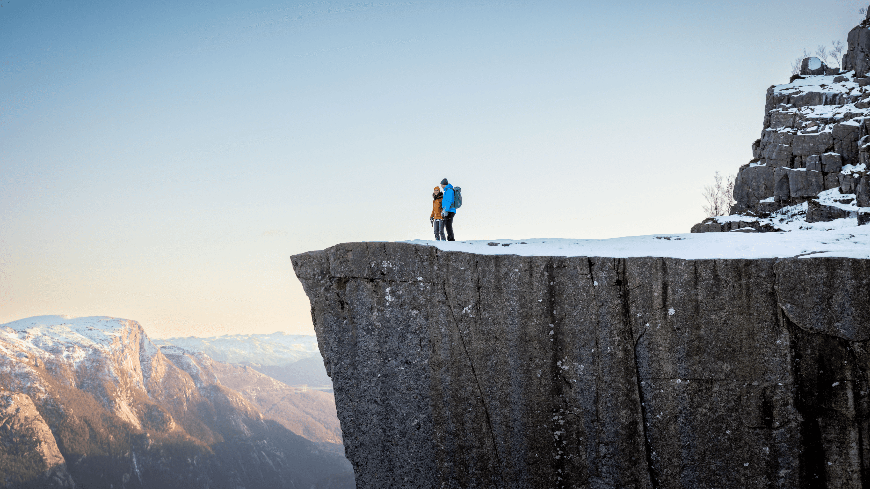Two people stood ona a cliff