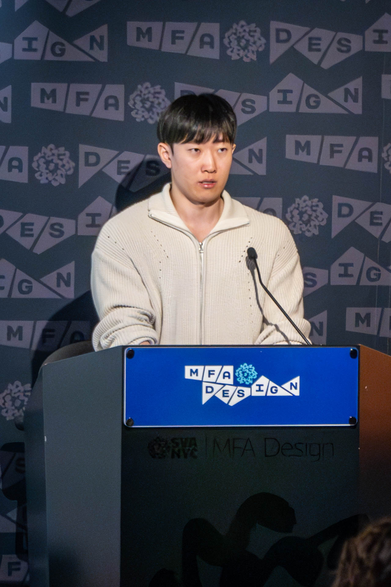student at a podium giving a presentation