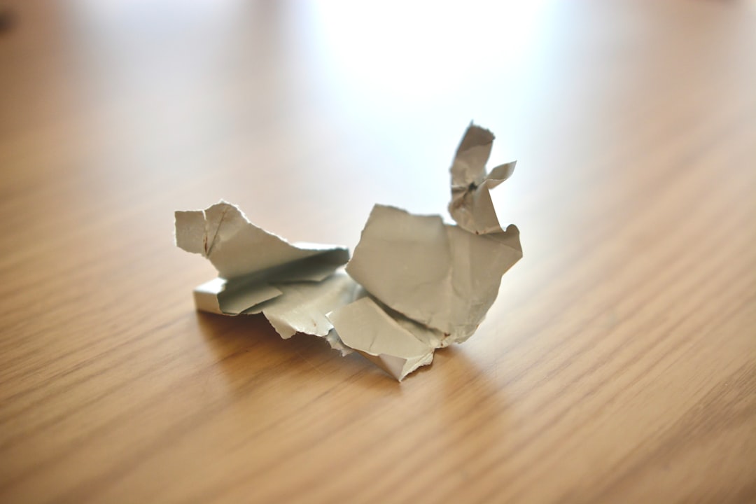 A piece of origami sitting on top of a wooden table