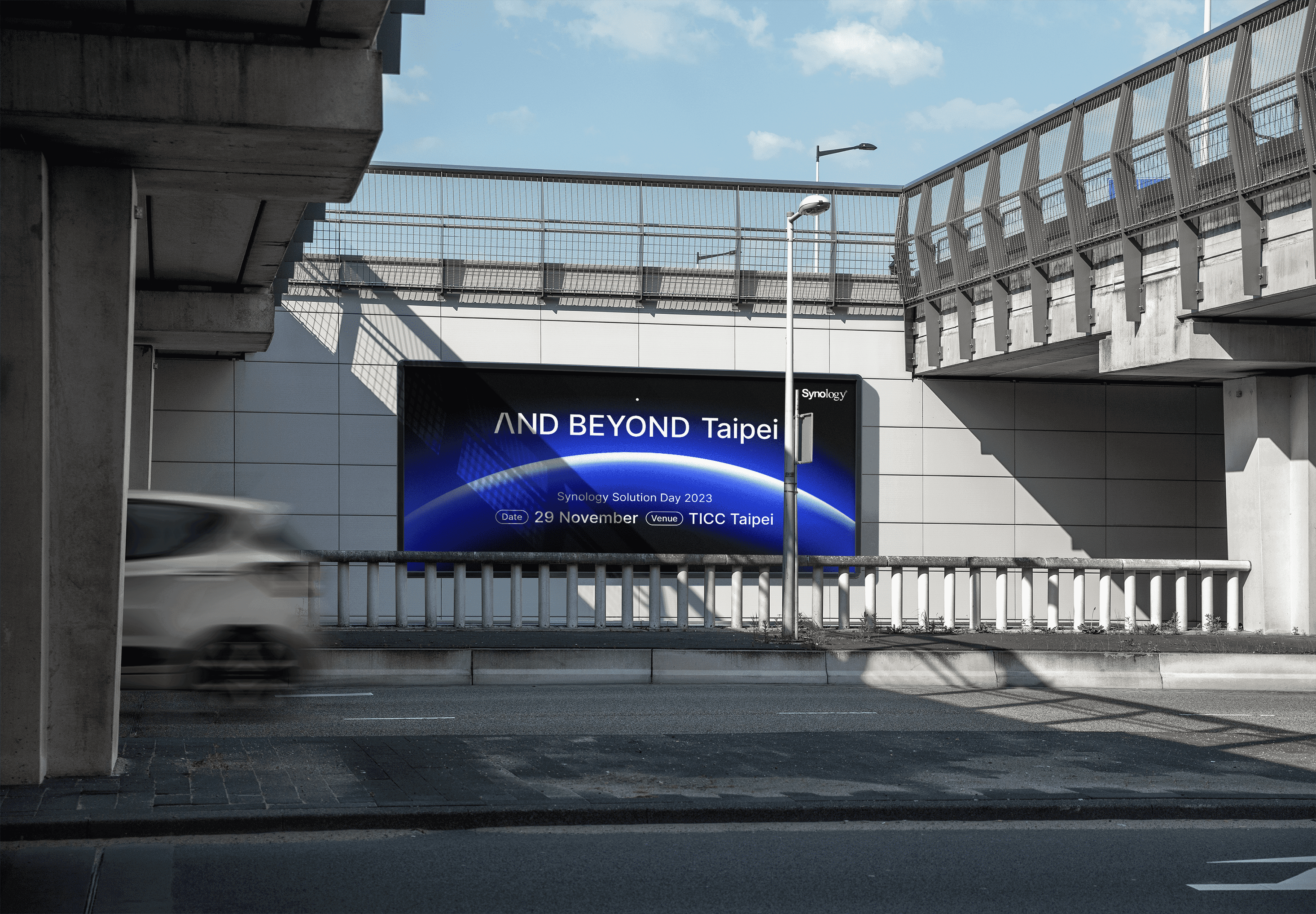 Hand holding waffle cone with three scoops of colorful pastel ice cream
