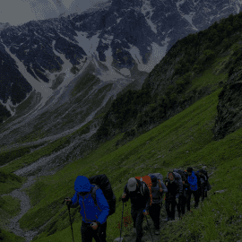 A group of people climbing mountains lead by Parth Upadhyaya. More than 2000 successful treks lead.