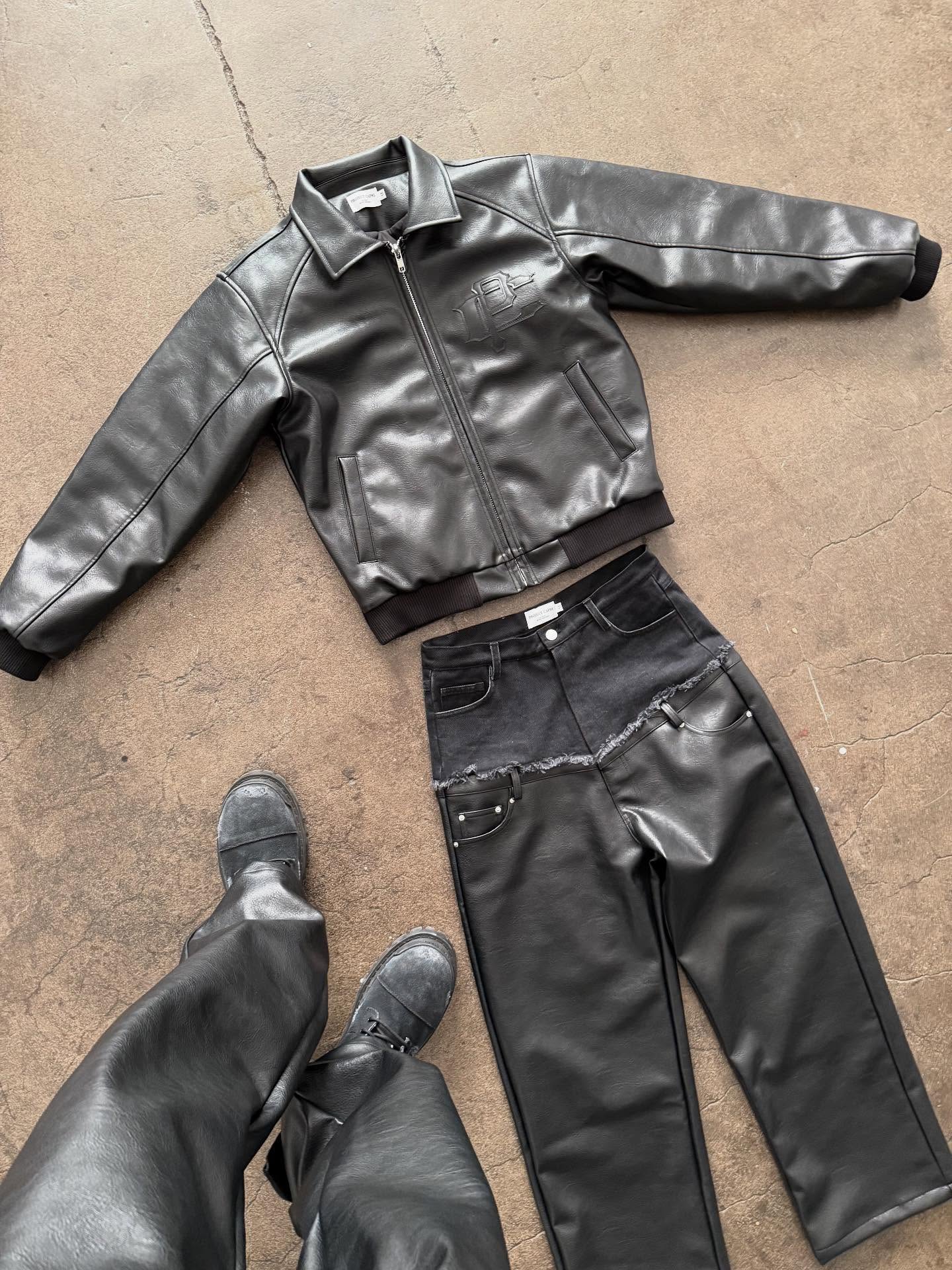 a group of people sitting around a laptop computer