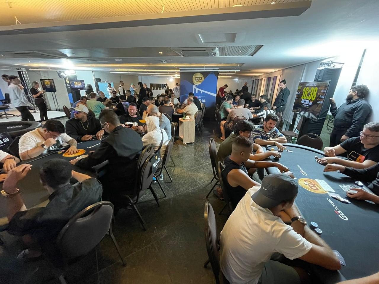 two people looking at a tablet and smiling