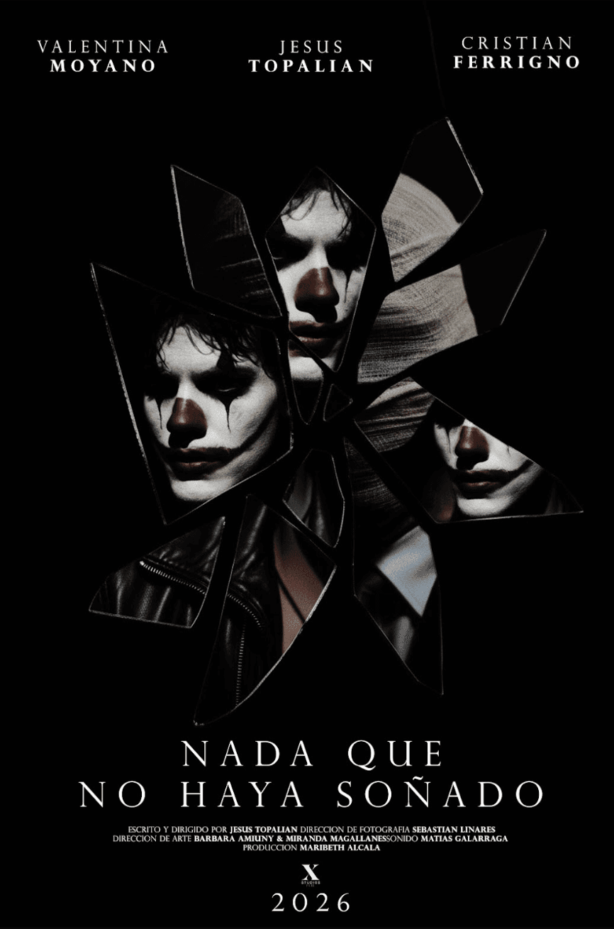 Woman in a light suit sitting thoughtfully against a terracotta wall