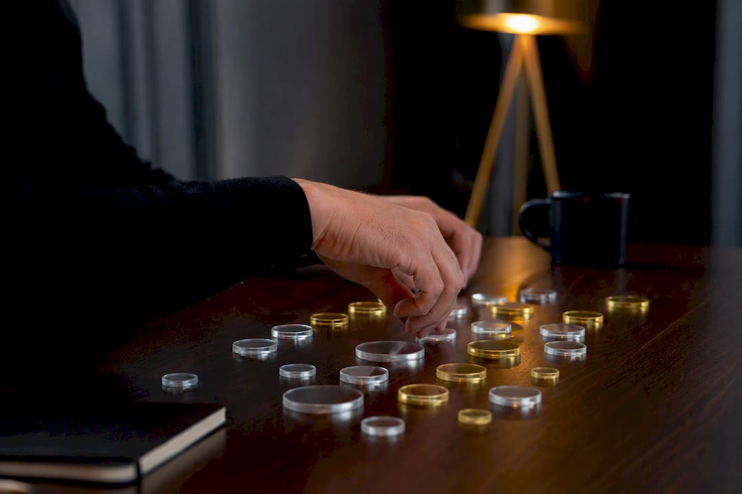 Hand sorting tokens representing churn benchmarks