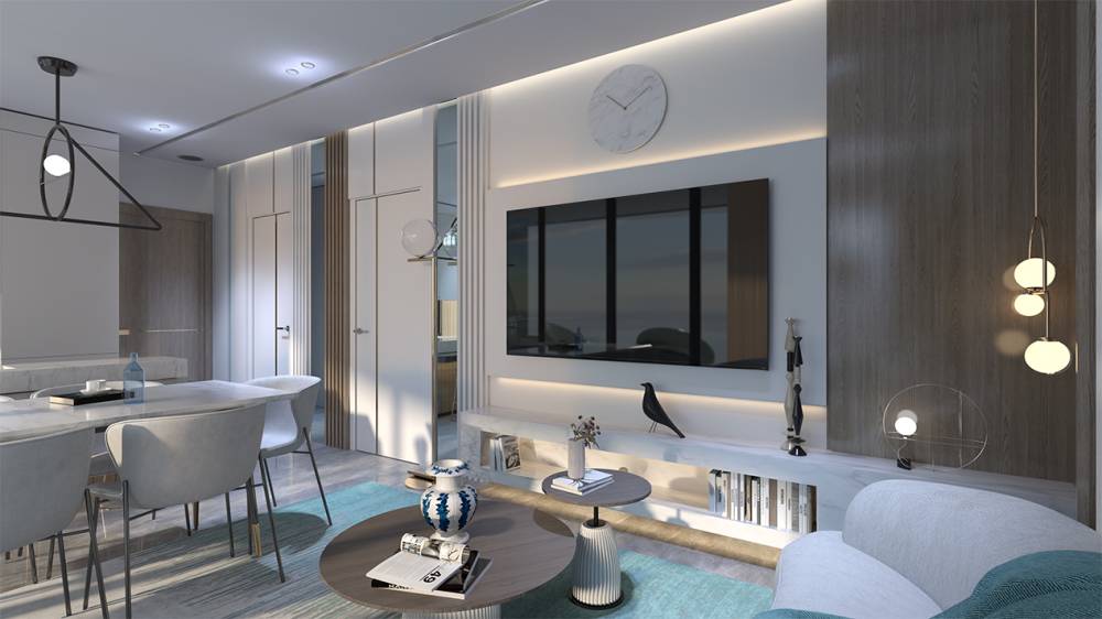 A modern living room featuring white furniture and a large TV, designed for comfort at Samana Santorini.
