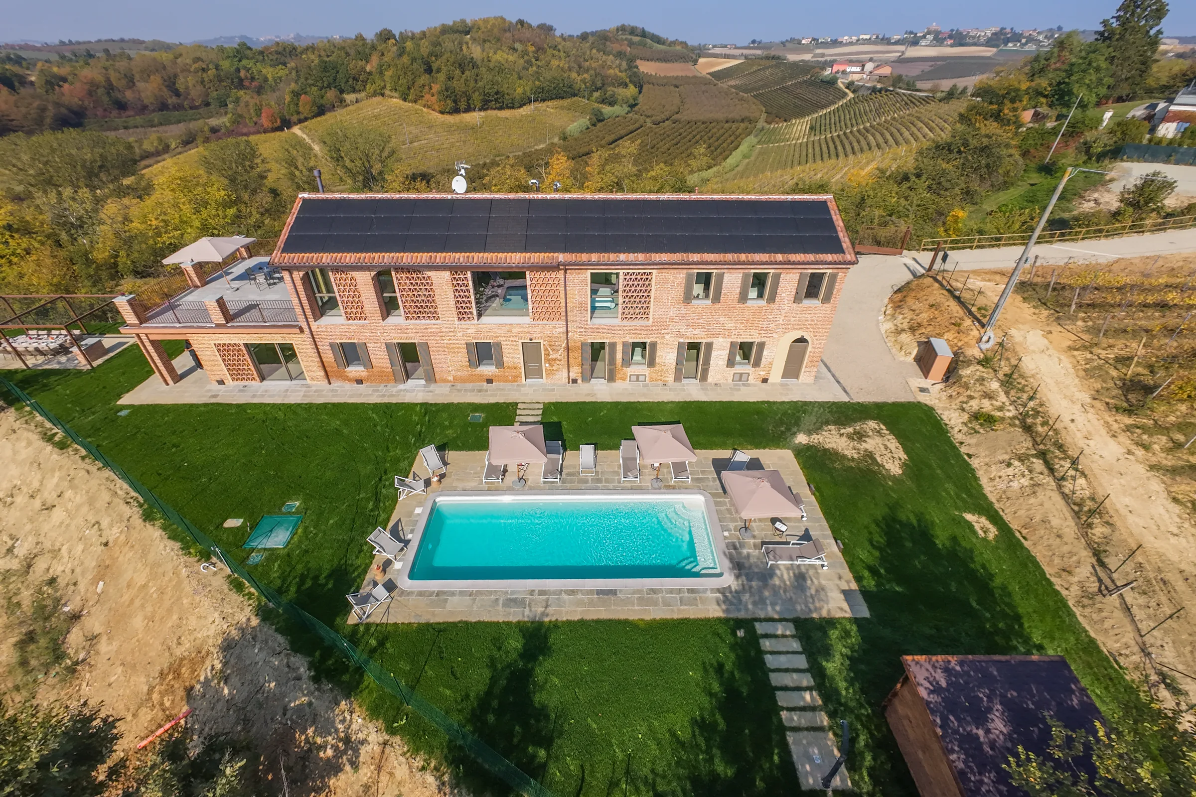 Aerial view of the villa and swimming pool — Fubine Monferrato, Italy. Photography by Yunes Calore.