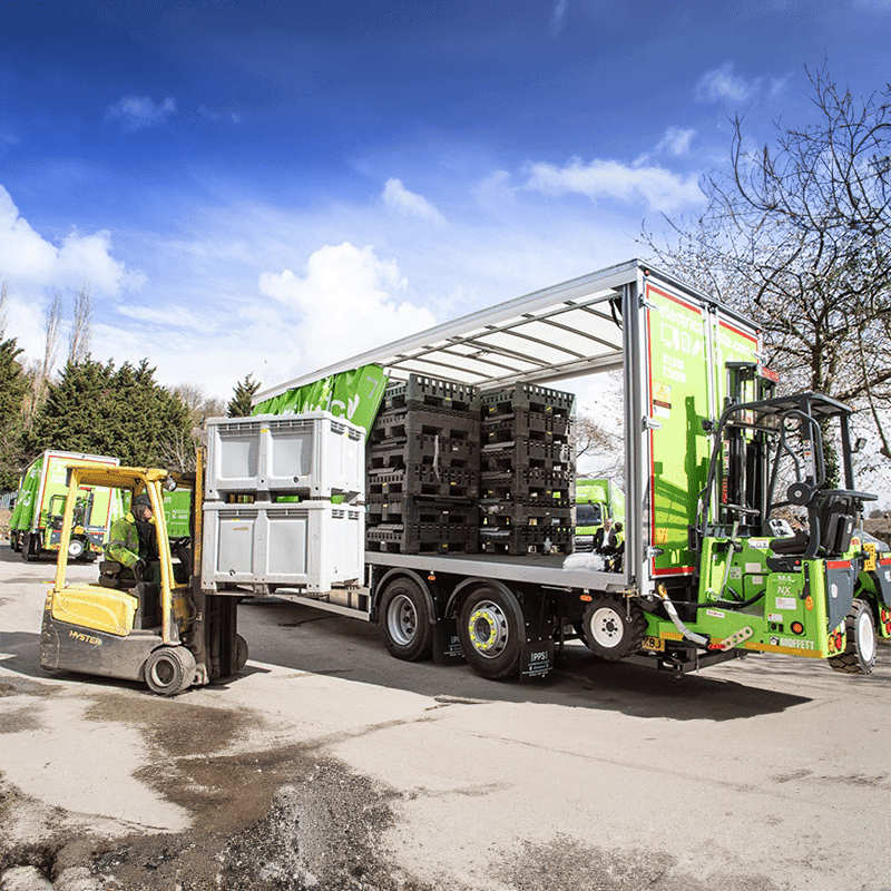 Waste Experts working loading a HGV