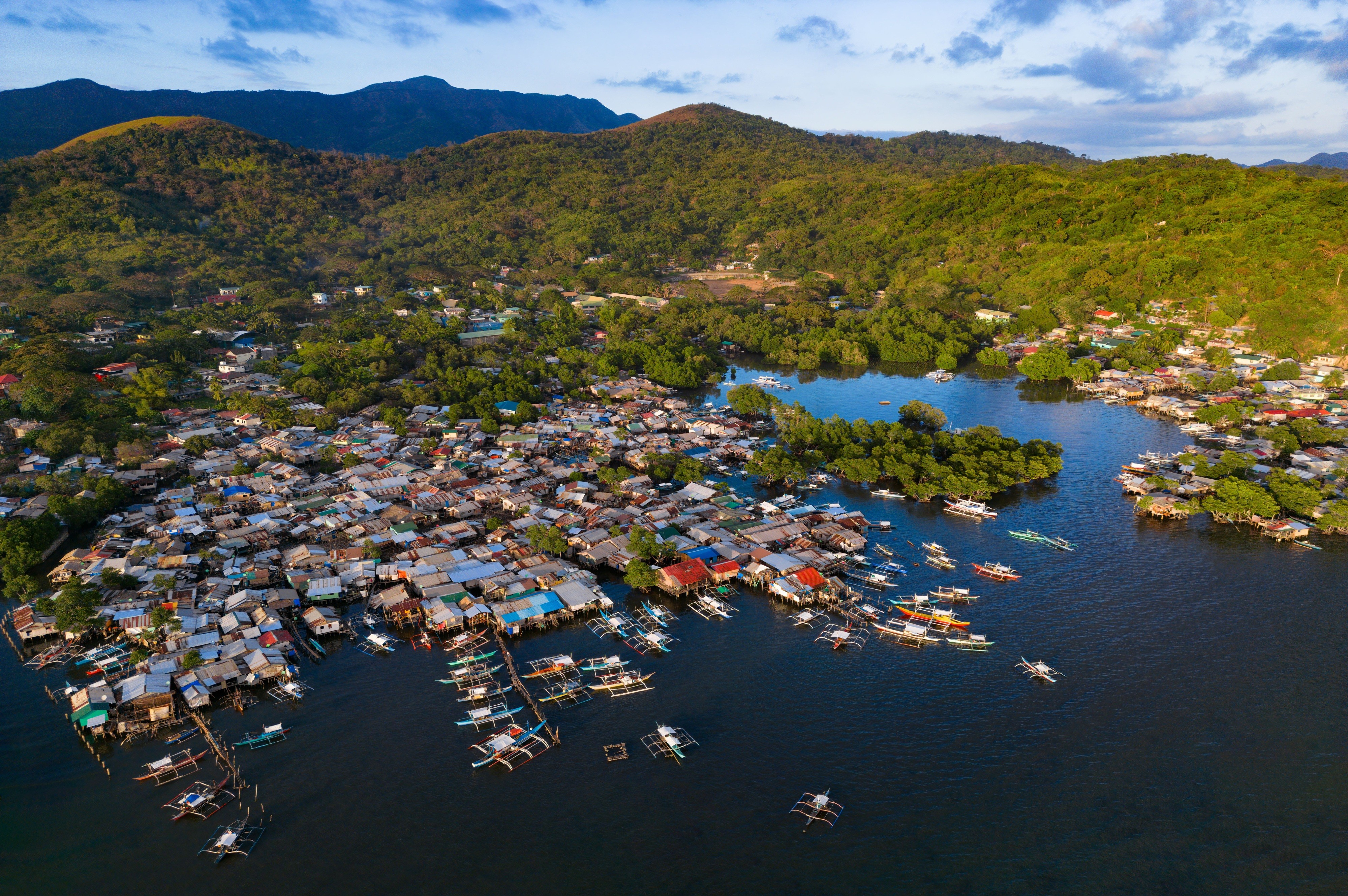 boats parked by a river shore