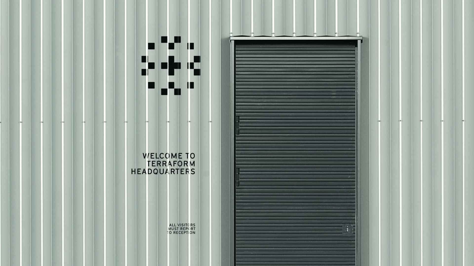 Streetside billboard with flyposters of the Batch.Works brand and illustrations