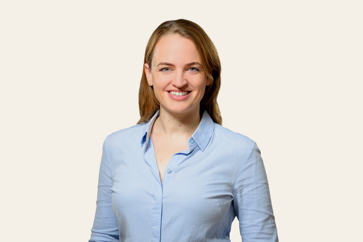 Diverse group of people in a modern office meeting.