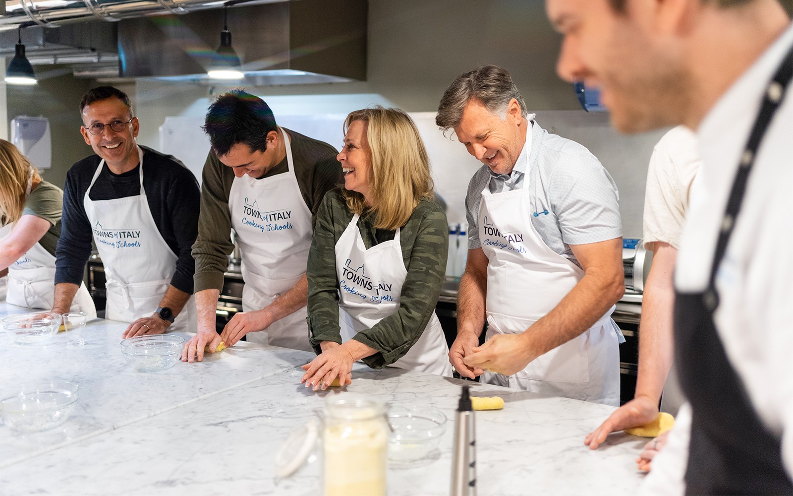 People making pasta during a cooking class in Milan.