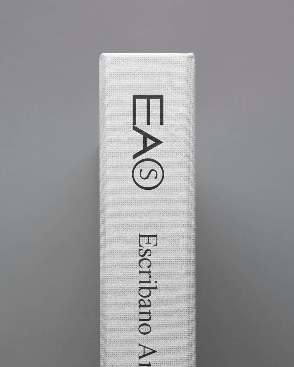 Photo of the spine of a book with with EAS logo printed on it.