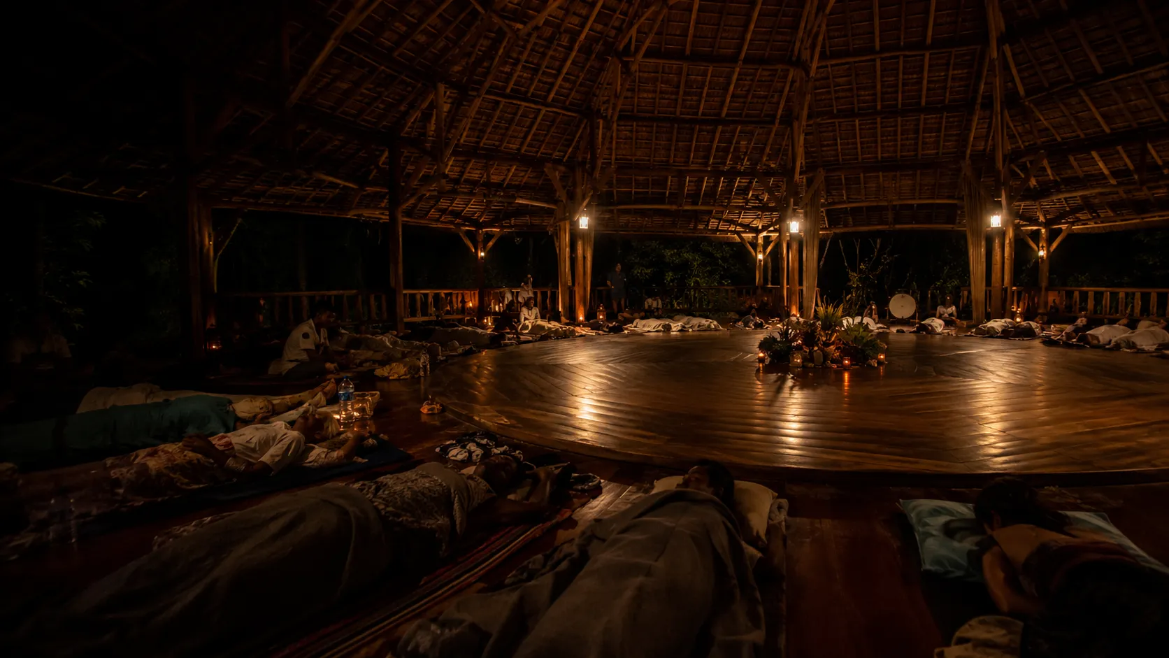 Open-air ayahuasca ceremony space prepared at night
