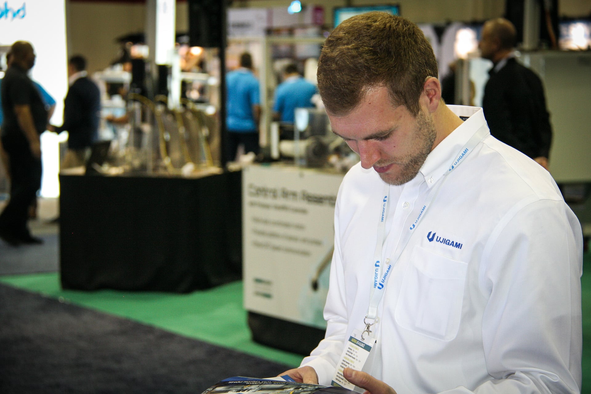 Ujigami logo on shirt.