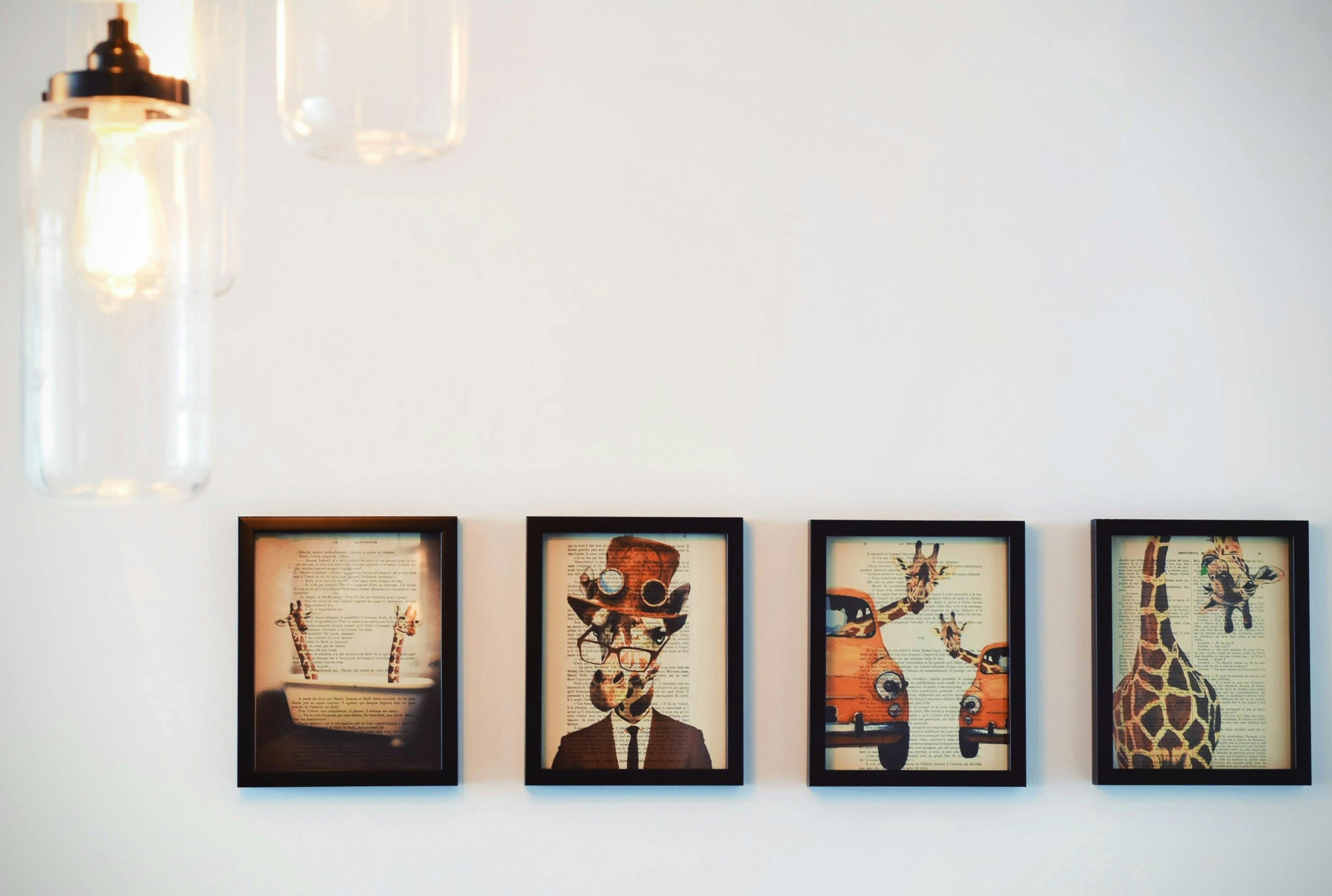 person holding two father and son photographs