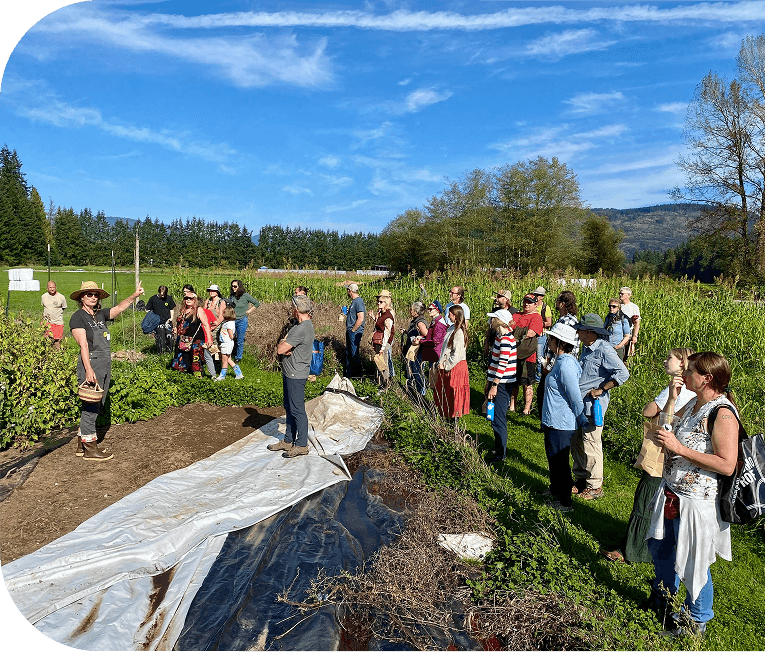 People gathered outdoors for a land-based demonstration project.