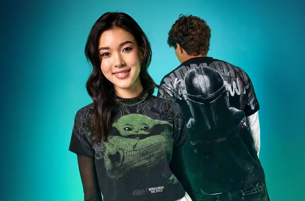 Two models in Star Wars Grogu and Mandalorian graphic tees against a teal backdrop